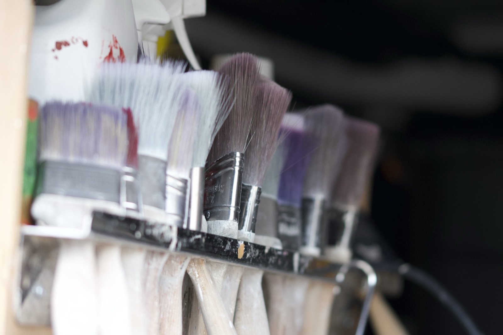 Close-up of well-used paint brushes