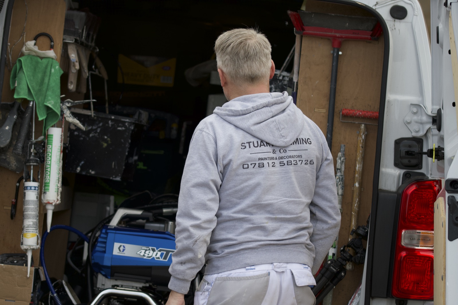 Stuart in the van next to the spray equipment